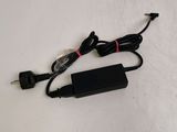 a black charger that is plugged into the wall