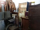 several pieces of furniture are stacked together in a room