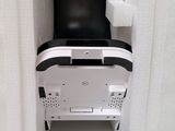 a black and white chair sitting in a corner of a room