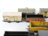 a lot of toy trains that are sitting on a table
