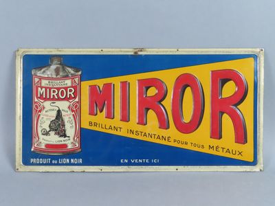 an old tin sign with a tin can of mirror on it