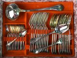 a tray with silverware and spoons in it