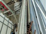 a pile of metal and wood outside of a building