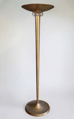 an image of a tall brass candle holder on a white background