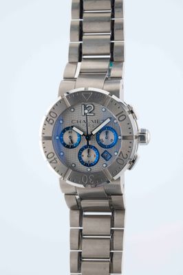 the stainless steel bracelet watch has a blue dial on the face