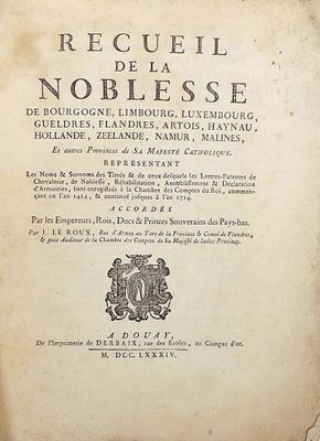 an old book with writing on it sitting on a table