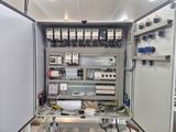 a large electrical panel with many wires in it