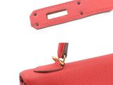 an image of a red purse with a gold clasp
