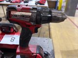 a cordless drill that is sitting on a table
