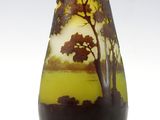 a vase that has a picture of a tree on it