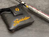 a baseball bat and a bag on a table