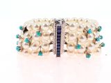bracelet with pearls and turquoise stones on a white background