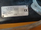 a close up of a metal tag on a sewing machine