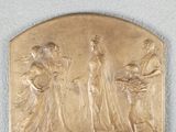 a gold plaque on the wall of a room with a clock
