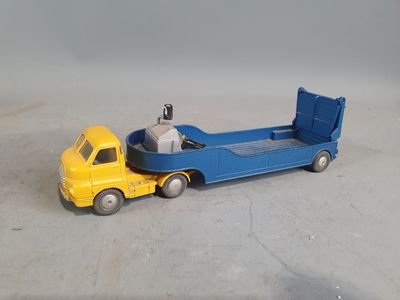 a toy truck with a bed on the back of it