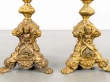 pair of antique brass candlesticks on stand with ornate decoration