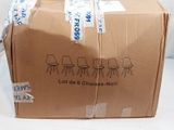 a cardboard box with a bunch of chairs on it