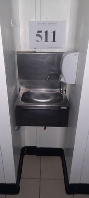a sink in a stall with a number 511 on it