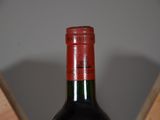 a bottle of wine that is sitting on a table