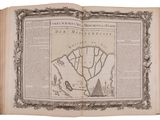 an old book with a map of the world on it