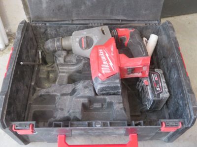 a tool box with a drill and a hammer inside of it