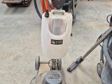 a machine that is sitting on the floor in the garage