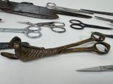 many different types of scissors on the table