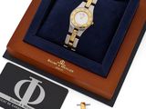an image of a gold and silver watch in a gift box