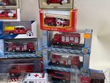 many different types of toy fire trucks on the table