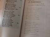someone is holding a book open to a page with a poem on it