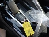 a car with a yellow tag on it ' s seat belt