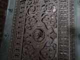 a metal door that has a design on it