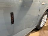 a close up of a car door with a sticker on it