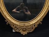a man taking a picture of himself in a mirror