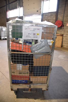 a metal cart with many boxes on it in a warehouse