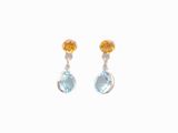 une paire de boucles d'oreilles ornées de topaze bleue et de citrine