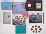 some coins are sitting on a table next to a book