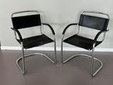 pair of chrome and black leather cantile chairs