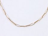 a close up of a gold chain necklace on a white background