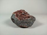 a close up of a piece of rock on a white surface