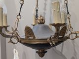 a chandelier that has a lot of candles on it