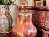 many vases on the table with flowers in the vase