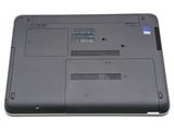 a close up of a laptop that is on a white surface
