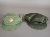 two hats that are sitting next to each other on a table