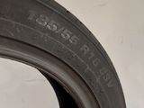 a close up of a tire on a white wall