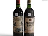 two bottles of wine sitting next to each other on a table