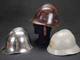 three helmets that are sitting next to each other on a table