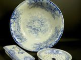 a blue and white bowl and a plate on a table