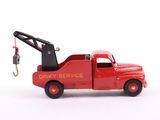 a red toy truck with a crane attached to it