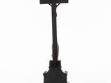 an old iron cross with a wooden cross on top of it